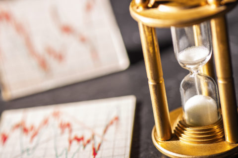 Sand Trickles Through An Hourglass With Graphics Showing Stock P